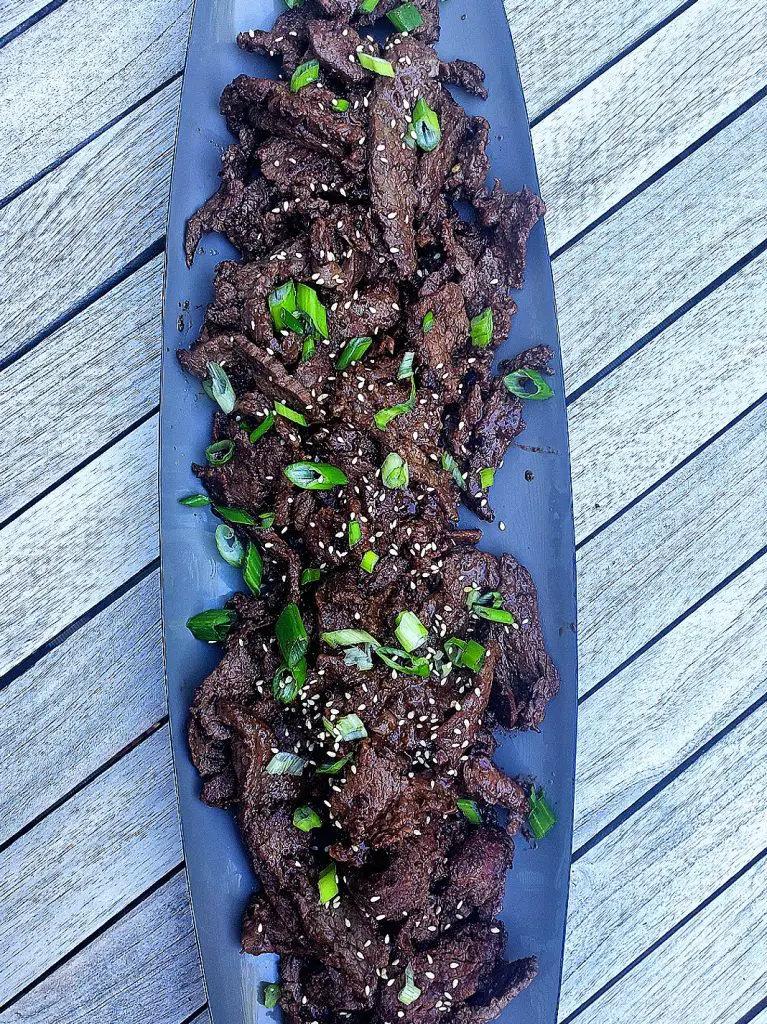 Korean Beef Bulgogi with scallions and sesame seeds