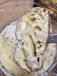 half croissant dipped in egg, milk and cinnamon