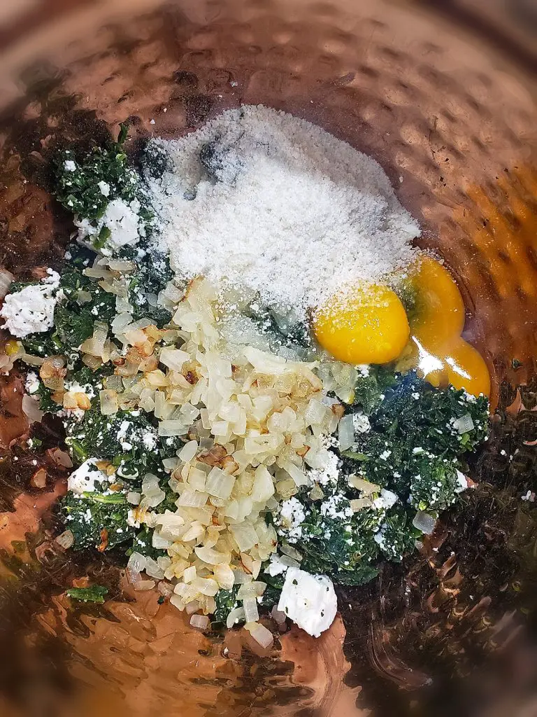 mixing bowl with spinach feta turkey burger ingredients