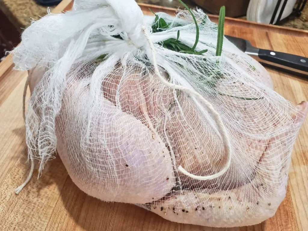 whole chicken wrapped in cheesecloth