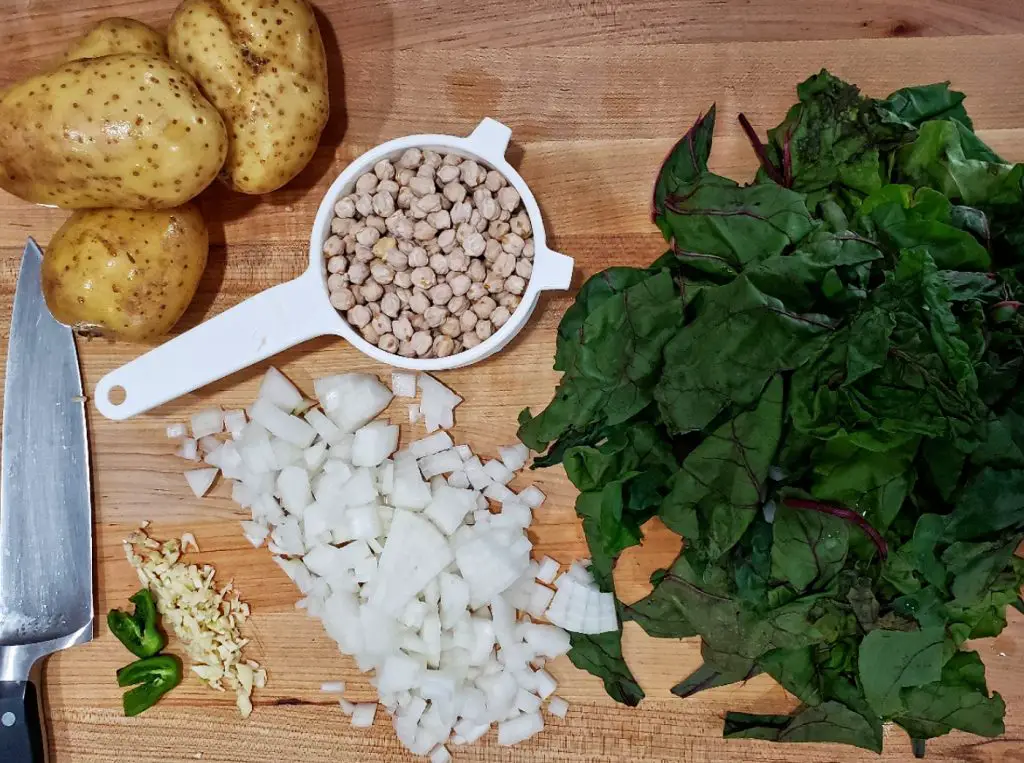 "chopped onion" "swiss chard" "minced garlic" "hot pepper" "yukon gold potatoes" "swiss chard potato and chickpea soup"