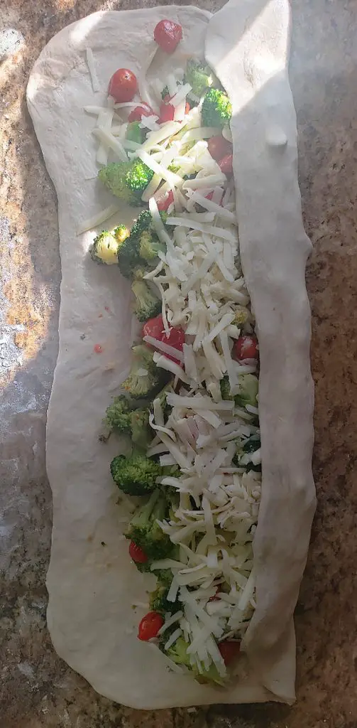 roll the stromboli into a log tube shape
