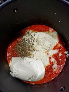 marinara, pureed cauliflower, ricotta cheese and dried spices in pot