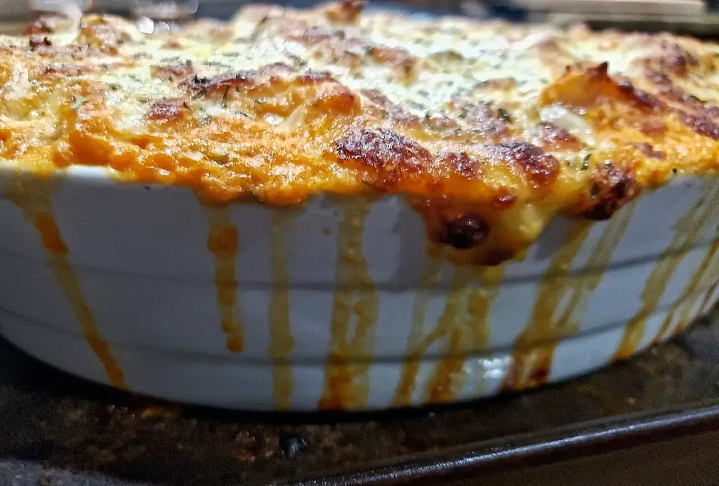 baked ziti bubbles over baking dish