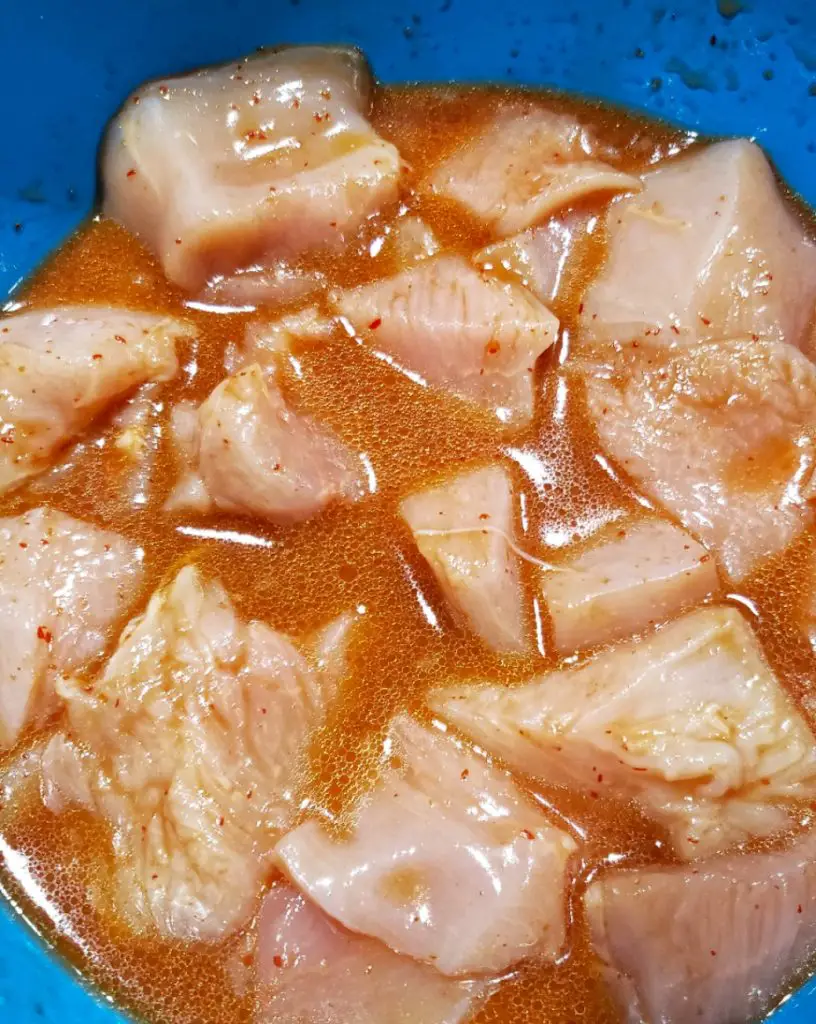 cubed chicken breast marinading