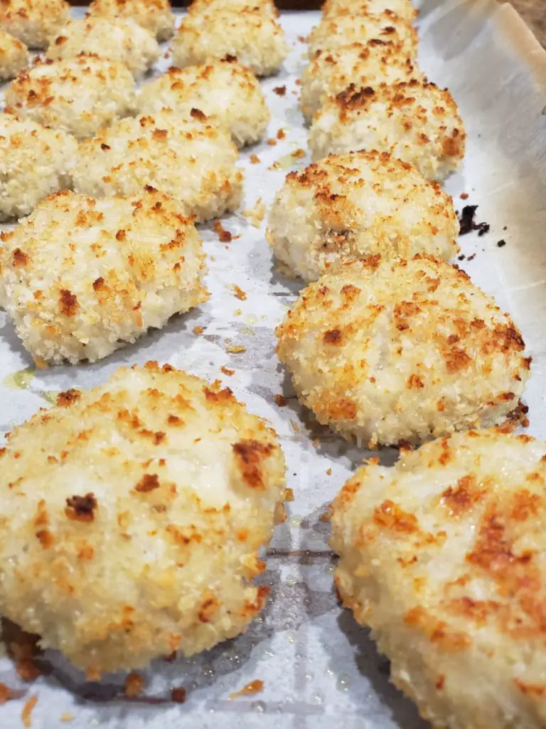 cooked chicken nuggets on baking sheet