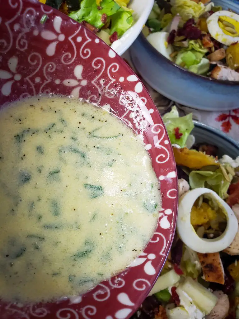 a mixing bowl of goat cheese vinaigrette