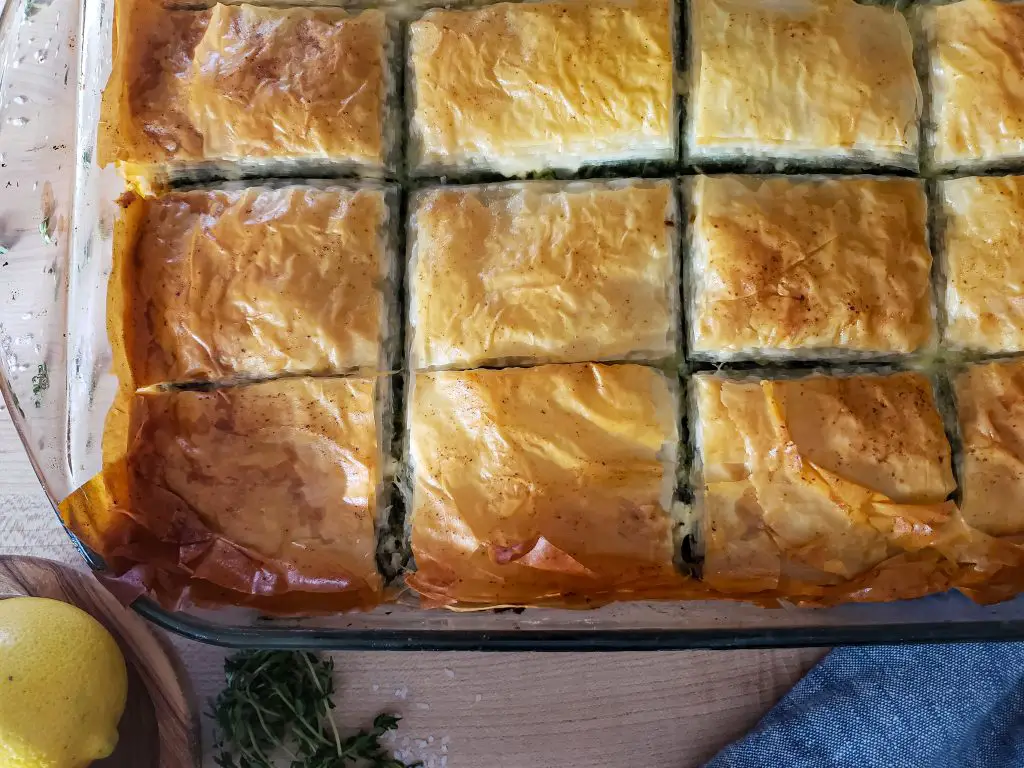 overhead close up of baked greek spanakopita spinach pie