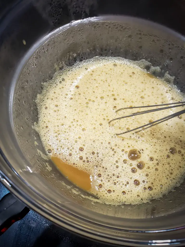 whisk egg yolks, espresso and sugar in double boiler to make dark chocolate mousse