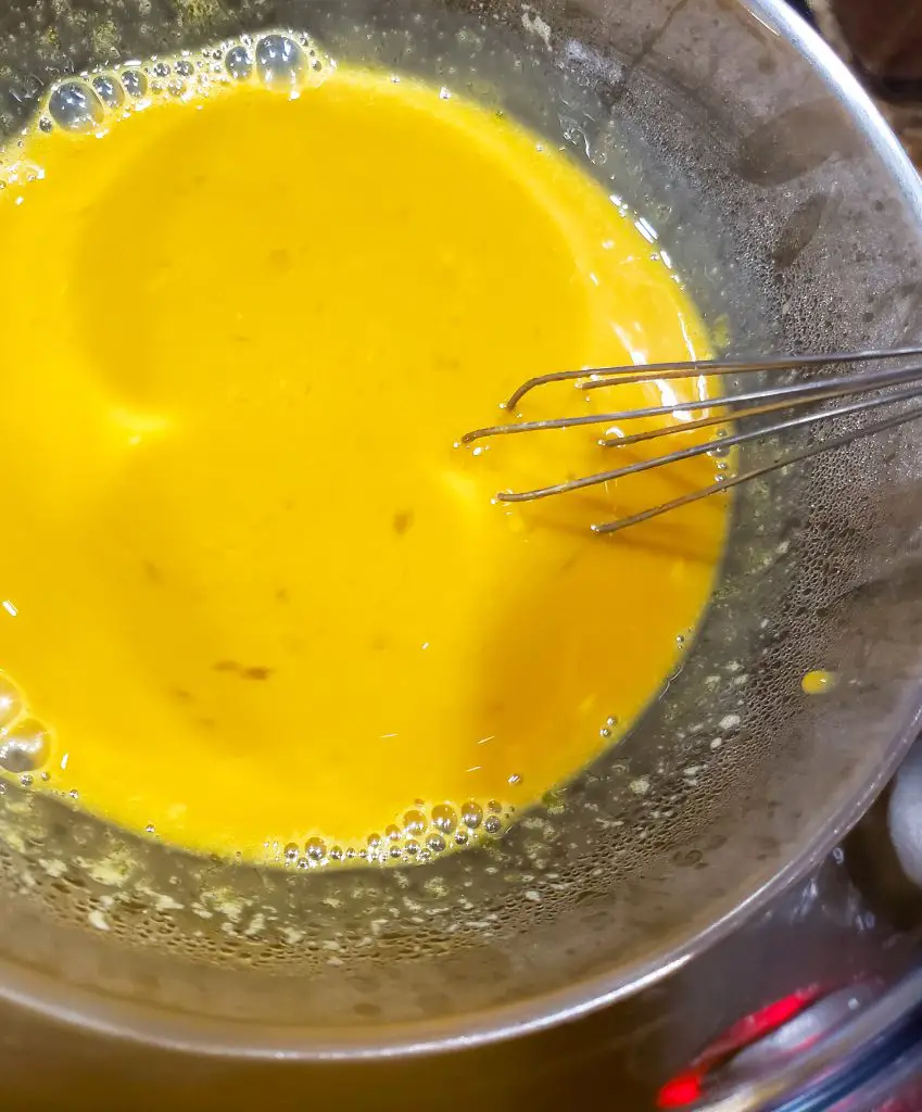 whisk egg yolks, espresso and sugar in double boiler to make dark chocolate mousse