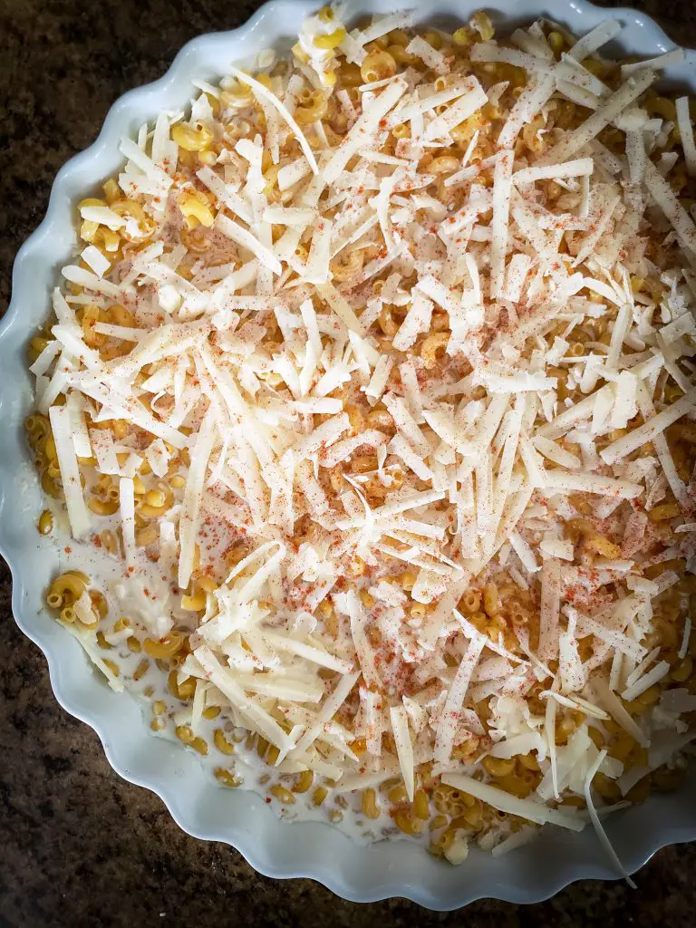 spinkle more cheese on top of lazy mac and cheese before baking