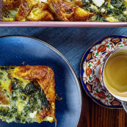 CROISSANT STRATA WITH SPINACH, FETA AND GRUYERE with cup of coffee