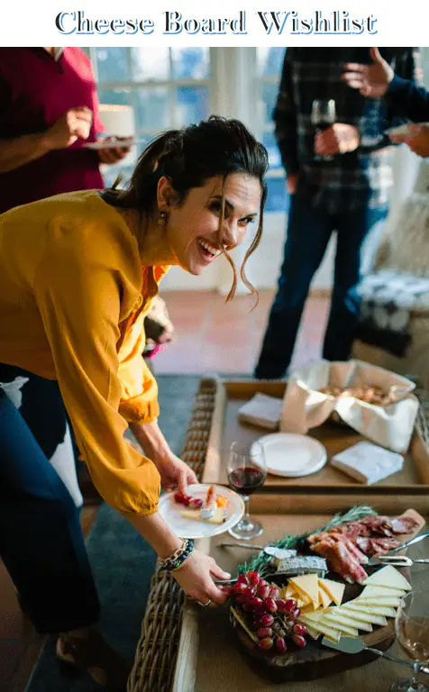 woman Brenda Lanzilli seving a high end cheese board
