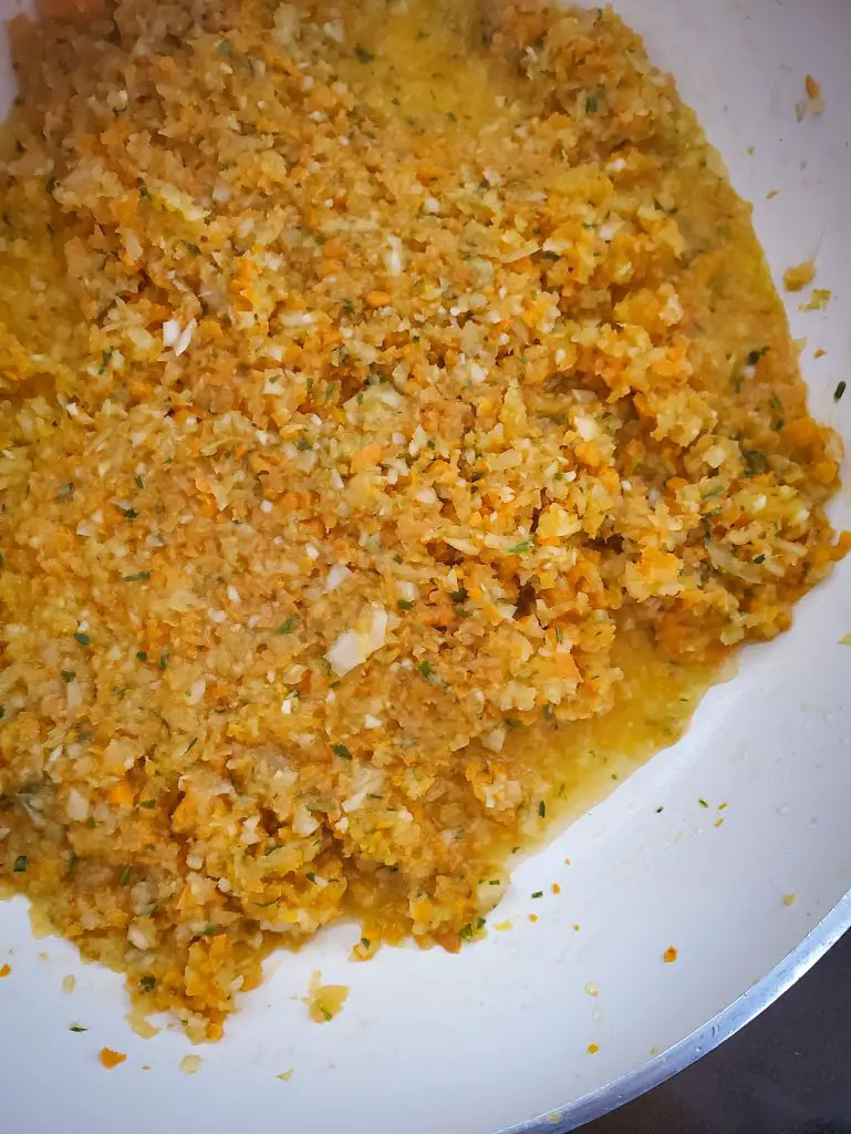 image of finely minced vegetables and herbs sauteing