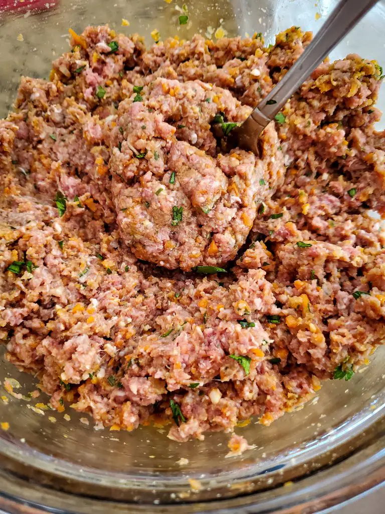 image of meatloaf mixture in glass mixing bowl