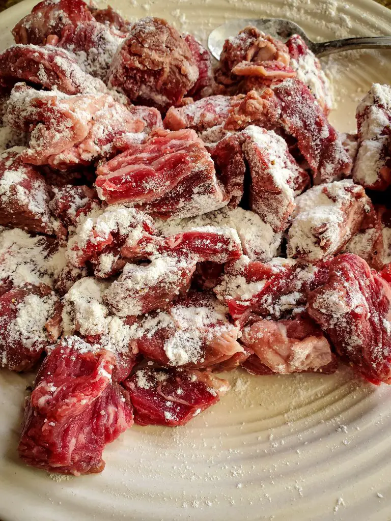 image of stew meat dusted with flour and salt and pepper