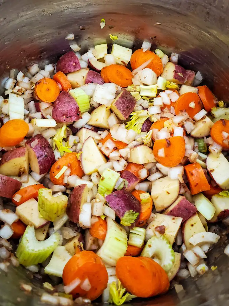 image of vegetables sauteing in instant pot for beef and barley soup