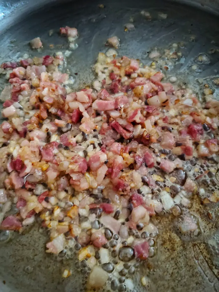 image of pancetta and minced shallots sauteed in sauce pan