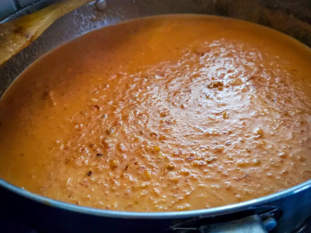 image of vodka cream sauce in large sauce pan on stove top