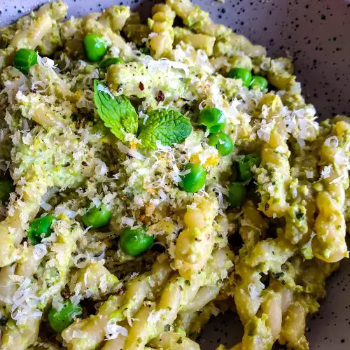 image of bowl of pasta with pea and mint pesto with lemon panko breadcrumbs