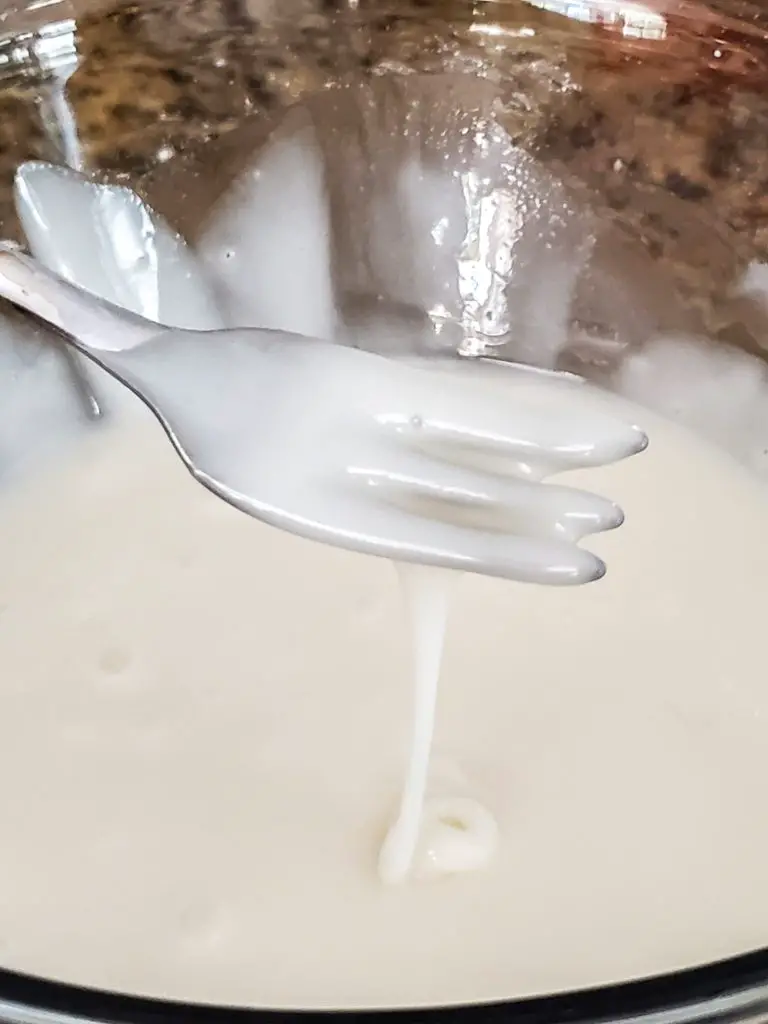 close up image of vanilla glaze for CHAI-SPICED APPLE FRITTERS WITH VANILLA GLAZE