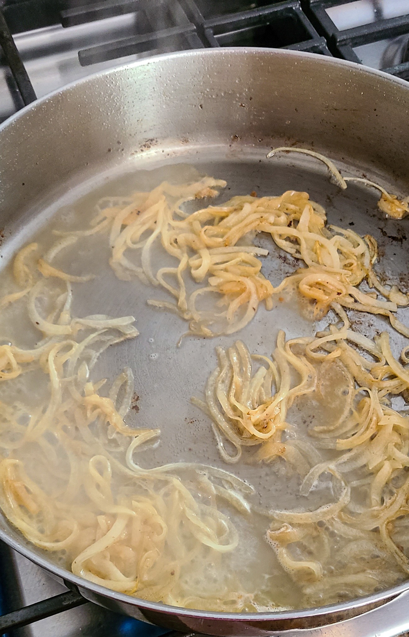 sauteed onion with sherry wine in skillet