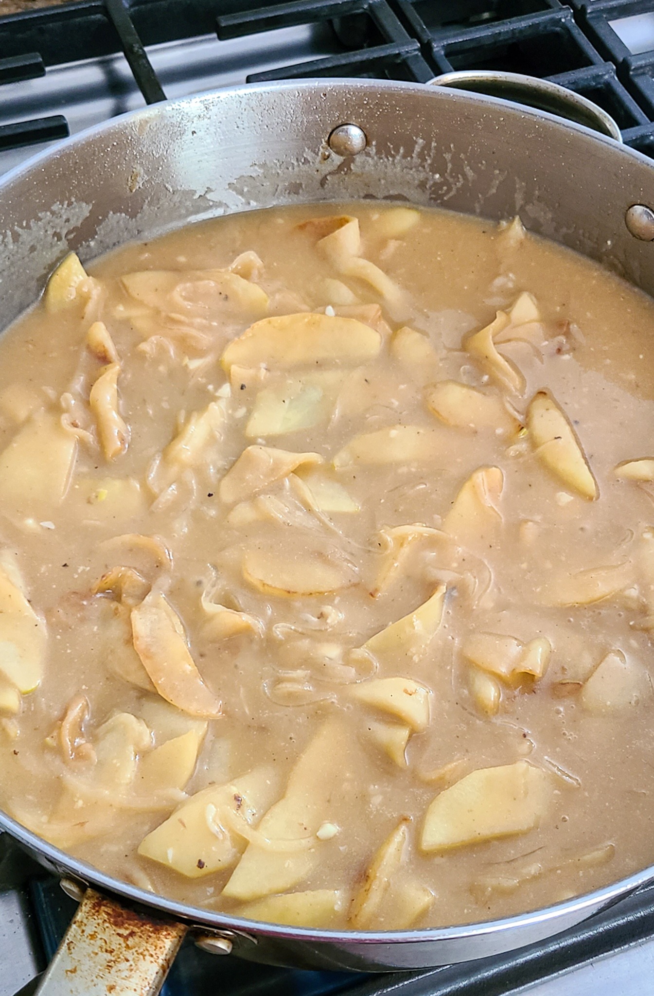 apples cider sherry pan sauce in deep skillet on stove
