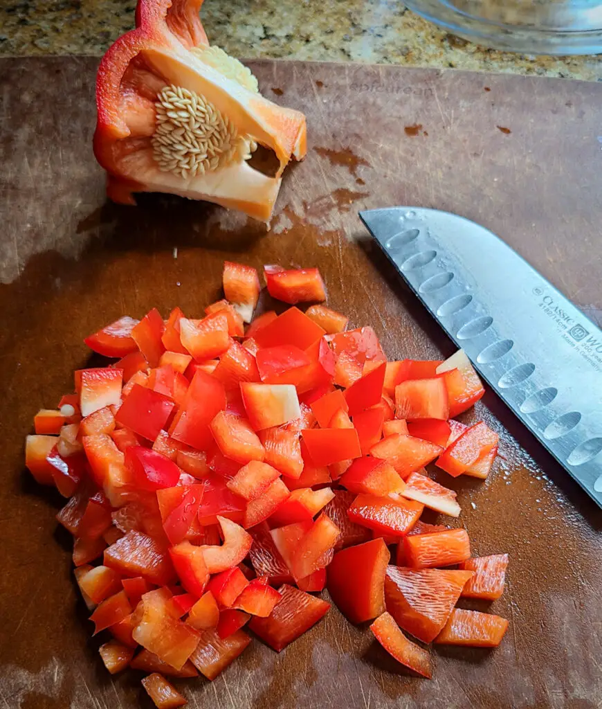 chopped red bell pepper on cutting board
