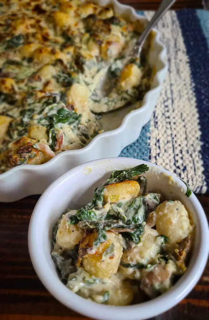 image of Swiss Chard and Baby Bella Gnocchi Gratin portioned into small ramekin side dish.