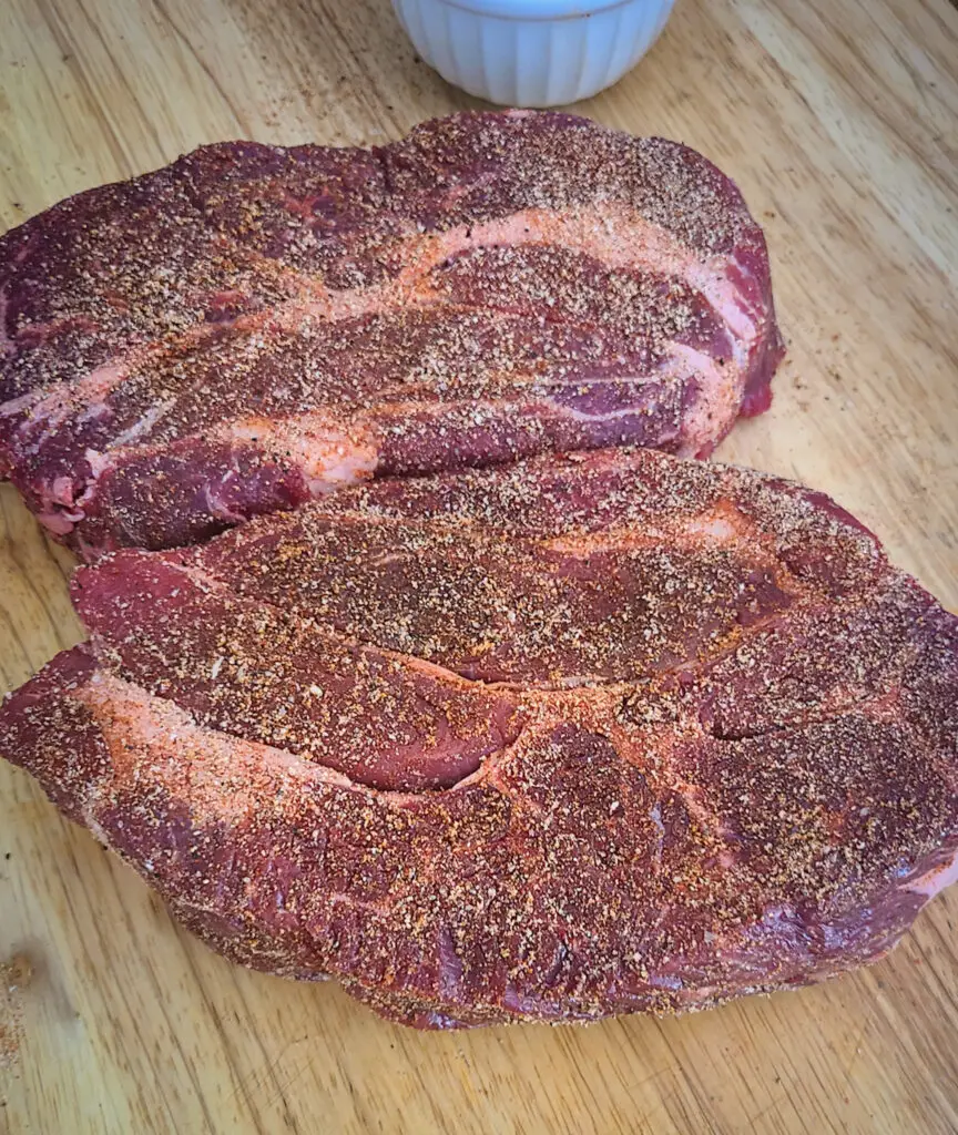 image of seasoned chuck roast on cutting board