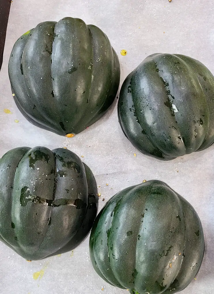 how to roast acorn sqaush, flip the squash cut side down and roast in oven 