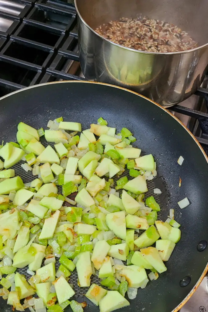  Add the chopped apple to sautéed onions and celery. Cook an additional 5-7, until the apple is crisp tender.