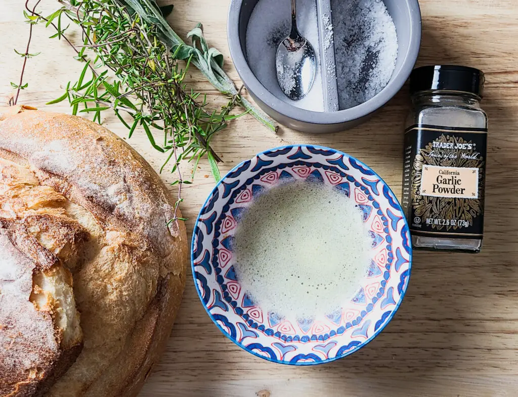 Ingredients needed to make toasted herb sourdough bread cubes for stuffing recipe