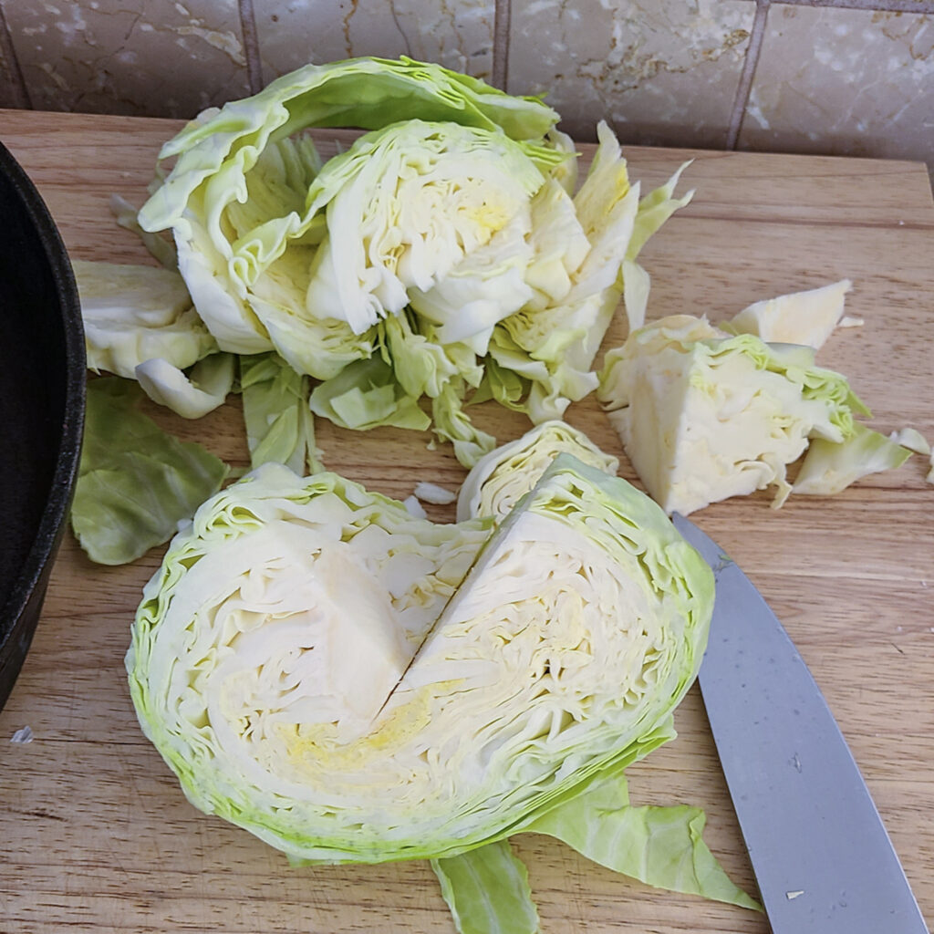 cored head of cabbage on cutting board