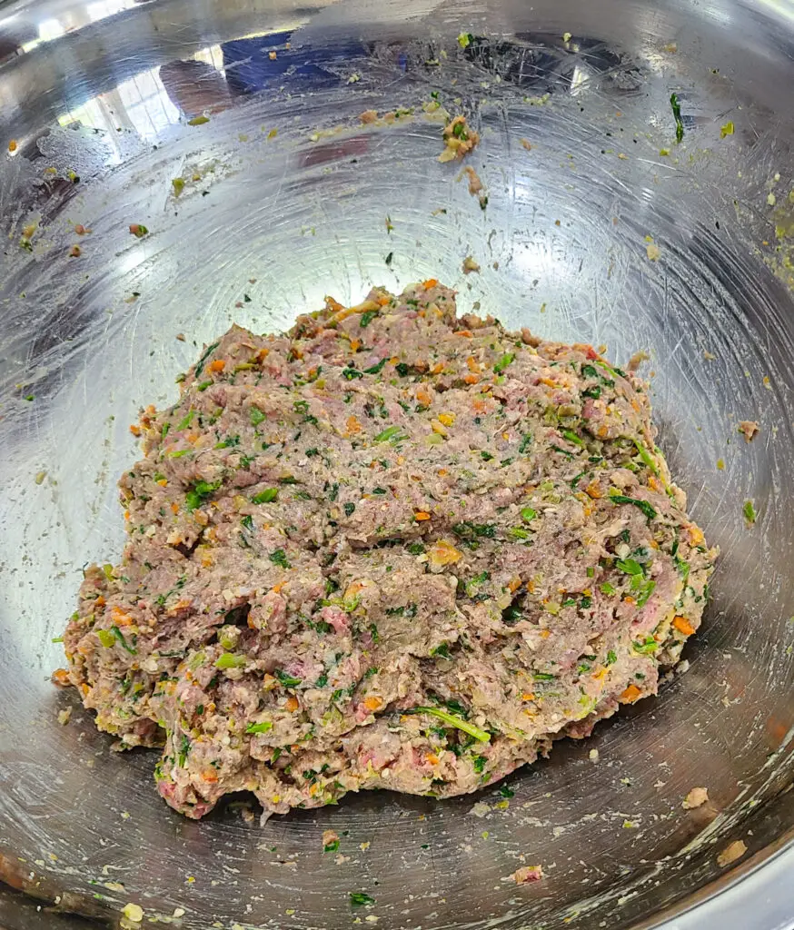 image of mixture of rax ground beef meatloaf in mixing bowl