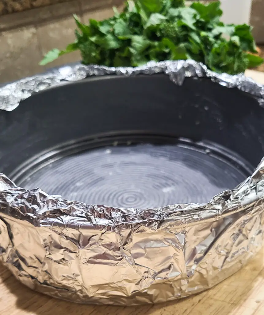springform pan tightly covered in aluminum foil to prevent any leakage 